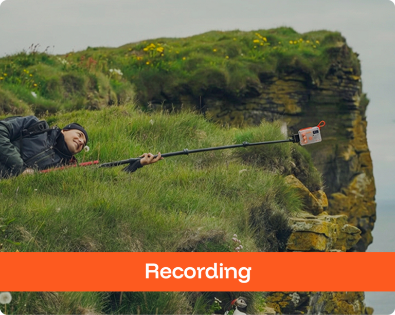 Man with Ultrasuono on a tripod recording a penguin